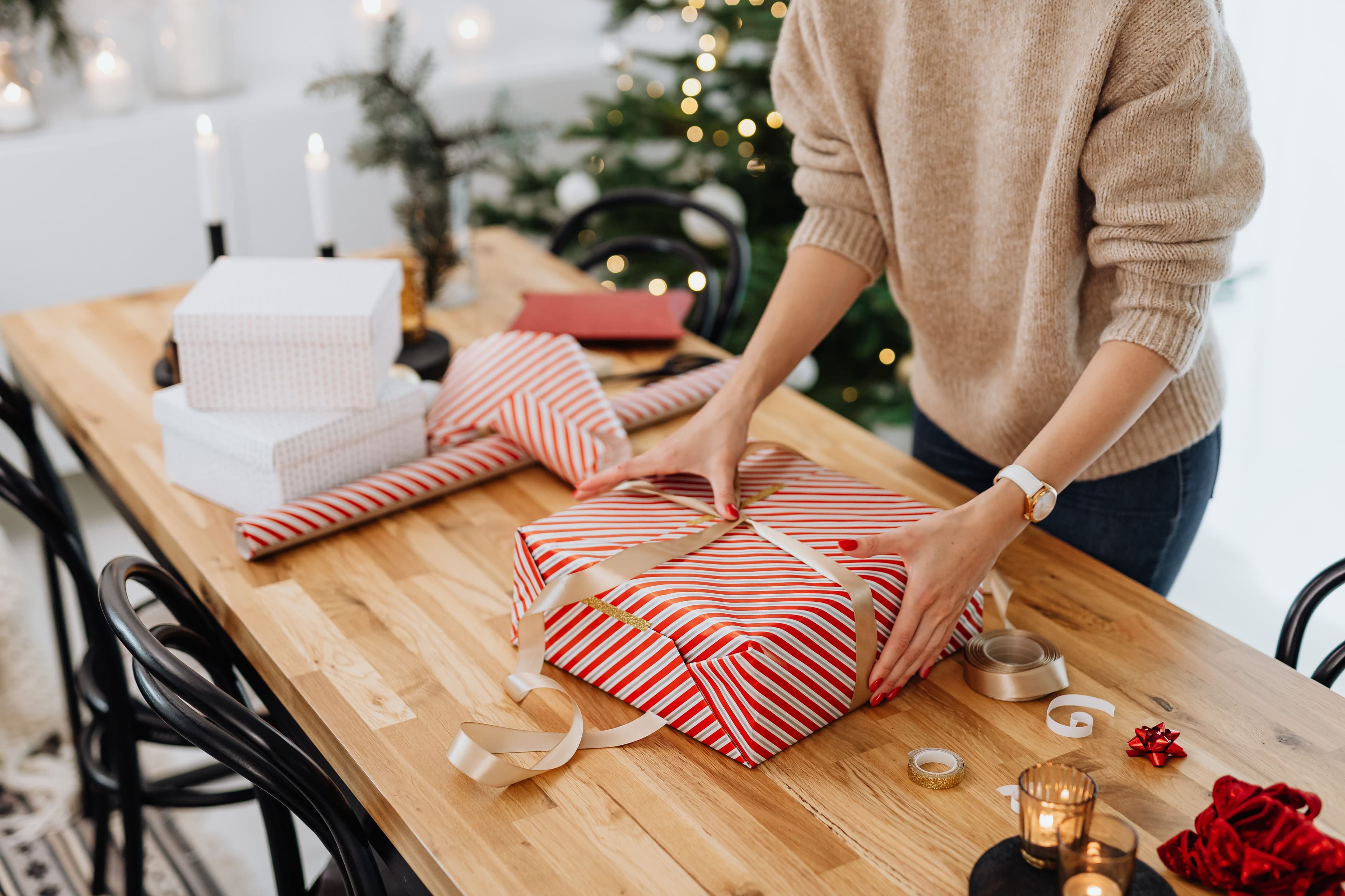 Hand-wrapping a beautifully styled gift